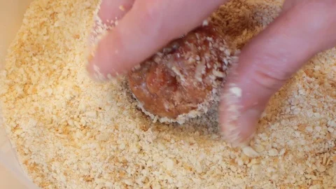 Meatball rolling in bread crumb 02 Stock Footage 107807894