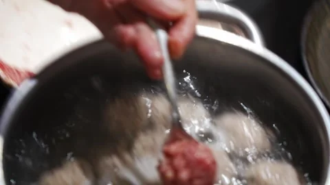 Meatballs are made from minced meat and dipped in boiling water. Stock Footage 300659112