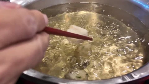 Meatballs boiling in hot pot broth video frame Stock Footage 325650253