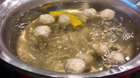 Meatballs boiling in hot pot broth video frame Stock Footage 325650257
