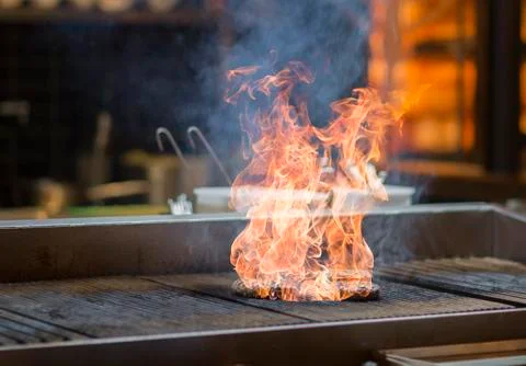 Meatballs in flames on a grill Stock Photos