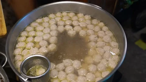Meatballs float in the pot to make noodles Thai Food. Stock Footage 140564277