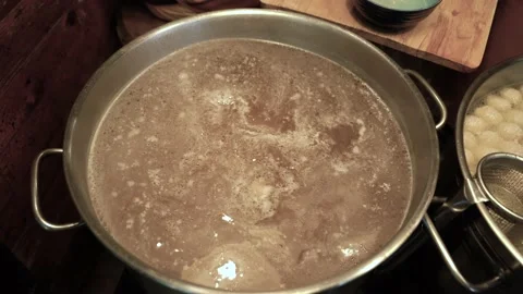 Meatballs float in the pot to make noodles Thai Food. Stock Footage 140564373