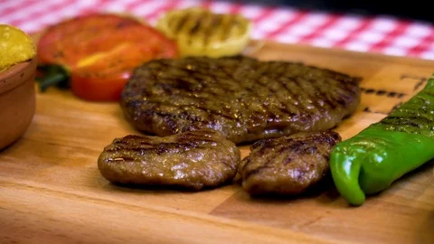 Meatballs lined up on a chopping board Video stock 105637911