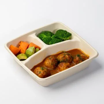 Meatballs with vegetables in a tray Stock Photos