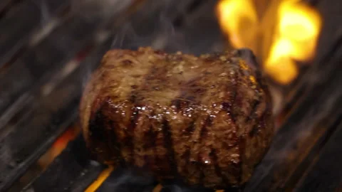 Meat,steak on grill and burning fire.preparing beef in restaurant, Video stock 276853043