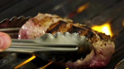 Meat,steak on grill and burning fire.preparing beef in restaurant, Stock-Footage 276853146