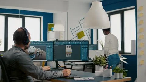 Mecanic technician working on cad software using computer Stock Photos