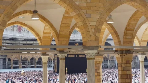 Mecca, Saudi Arabia- yellow Arches of Al-Haram and Kaaba Stock Footage