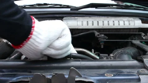 Mechanic Adding Coolant to Car radiators Stock Footage 66767913