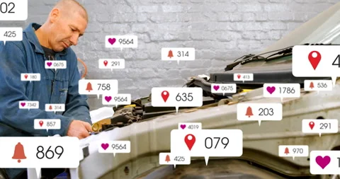 Mechanic adjusting car engine in auto shop, adding floating heart, bell and pin Stock Footage 308101649