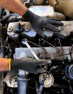 Mechanic Adjusting Engine Components Stock Photos