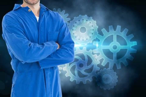 Mechanic against background with cogs Stock Photos