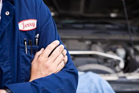 Mechanic: anonymous mechanic by engine Stock Photos