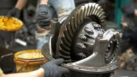 Mechanic applying compound on the part of gearbox during repairing. Stock Footage 71391775