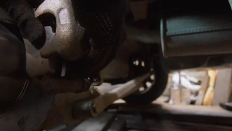 Mechanic assembling car brake caliper and pads Stock Footage 326142272