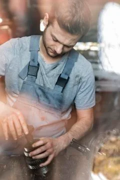 Mechanic assembling car parts Stock Photos