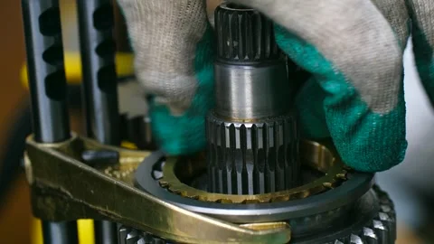Mechanic assembling car transmission gearbox Stock Footage 318510991