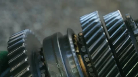 Mechanic assembling gearbox with gears and bearings Stock Footage 317907141