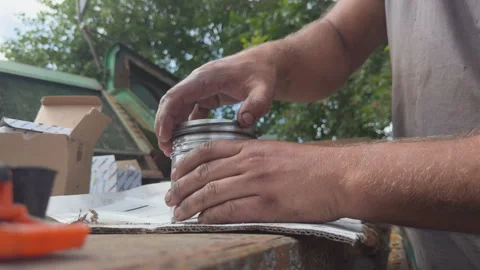 Mechanic assembling new piston with rings for engine repair Stock Footage 338411090