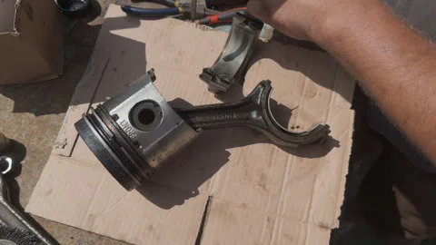 Mechanic assembling piston connecting rod bearing Stock Footage 338411101