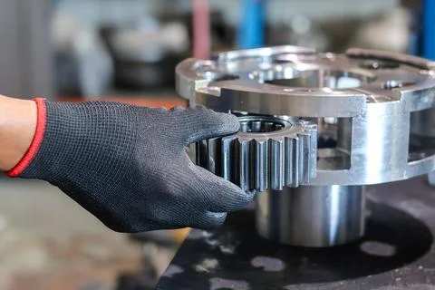 Mechanic Assembling Planetary Gear Carrier. Stock Photos
