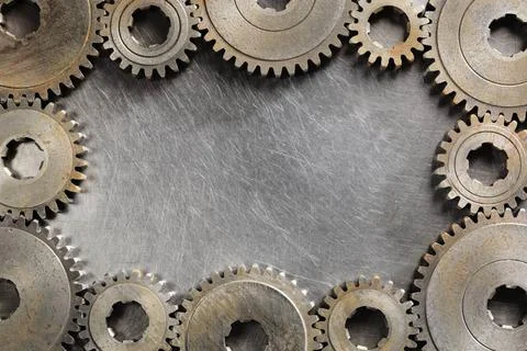 Mechanic Background Background image made of steel and old cog wheels. Cop... Stock Photos