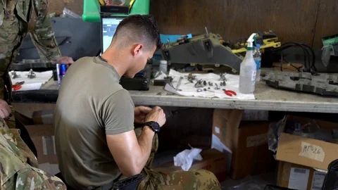 Mechanic Bay at Bagram co Stock Footage 124548155