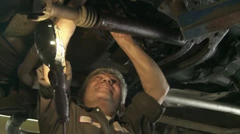 Mechanic Beneath Car Stock Footage 22796064