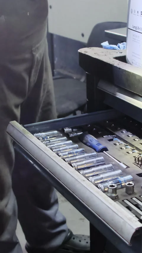 Mechanic carefully searches through toolbox selecting right part Video stock 317653789