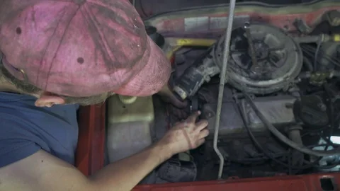 A mechanic changes timing belts at a service station Stock Footage 110864111