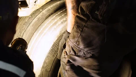 The mechanic changes the wheel of the truck. Auto Workshop. Stock Footage 243848858
