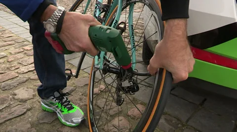 Mechanic checking bike's tire pressure Stock Footage 37029488