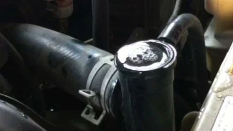 Mechanic checking car radiator overheating engine deterioration repair.. Stock Footage 96732235