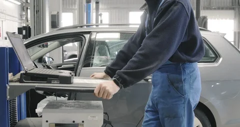 Mechanic Is Checking Cars Elements With The Help Of The Computer Stock-Footage 125009258