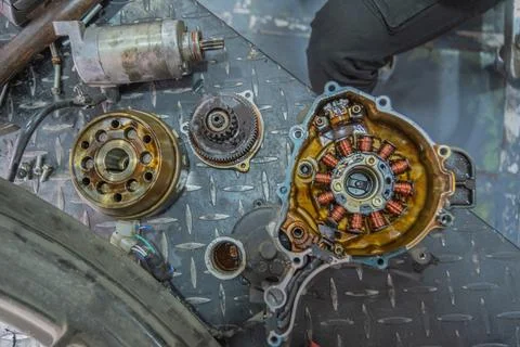 Mechanic checking gearbox in a workshop Stock Photos