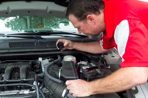 A Mechanic Checking A Master Cylinder Stock Photos