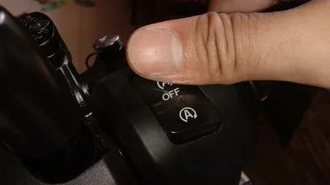 A mechanic is checking the motor button Stock Footage 242662192