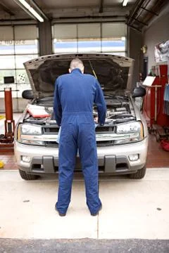 Mechanic: checking out the engine Stock Photos