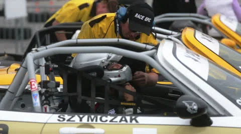 Mechanic checking racing car Stock Footage 24492799
