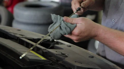 Mechanic Checks Oil Stock Footage 28809376