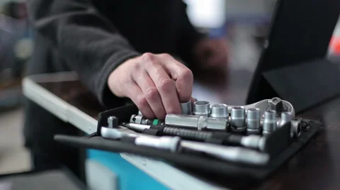 Mechanic chooses right socket for the wrench Stock Footage