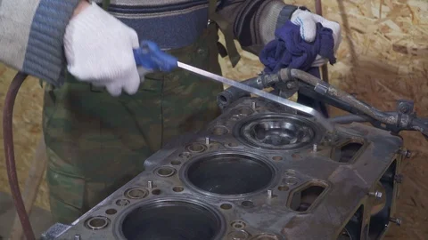 A mechanic cleans a compressor large car engine Stock Footage 105279607