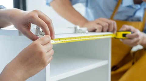 Mechanic concept two officers assembling furniture together, preparing for th Stock Photos