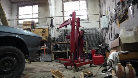 A mechanic disassembles an old dirty car Stock-Footage 221433789
