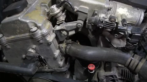 A mechanic disassembles an old dirty car Видео 222888709
