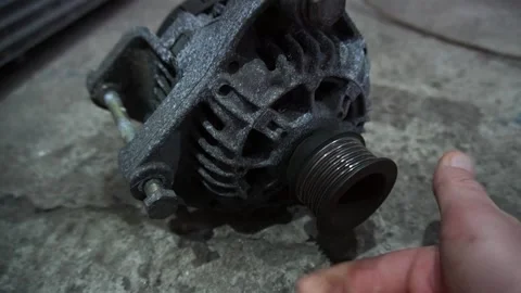 A mechanic disassembles an old dirty car 動画素材 222888825