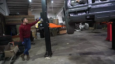 A mechanic disassembles an old dirty car Stock-Footage 222889114