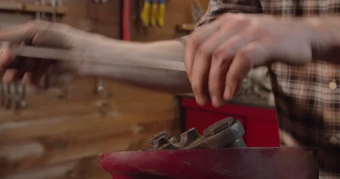 Mechanic disassembling classical motorcycle for restoration in workshop garage 動画素材 146116758