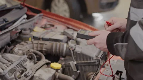 Mechanic Doing Auto Diagnostic with Car Code Reader Stock Footage 169701536
